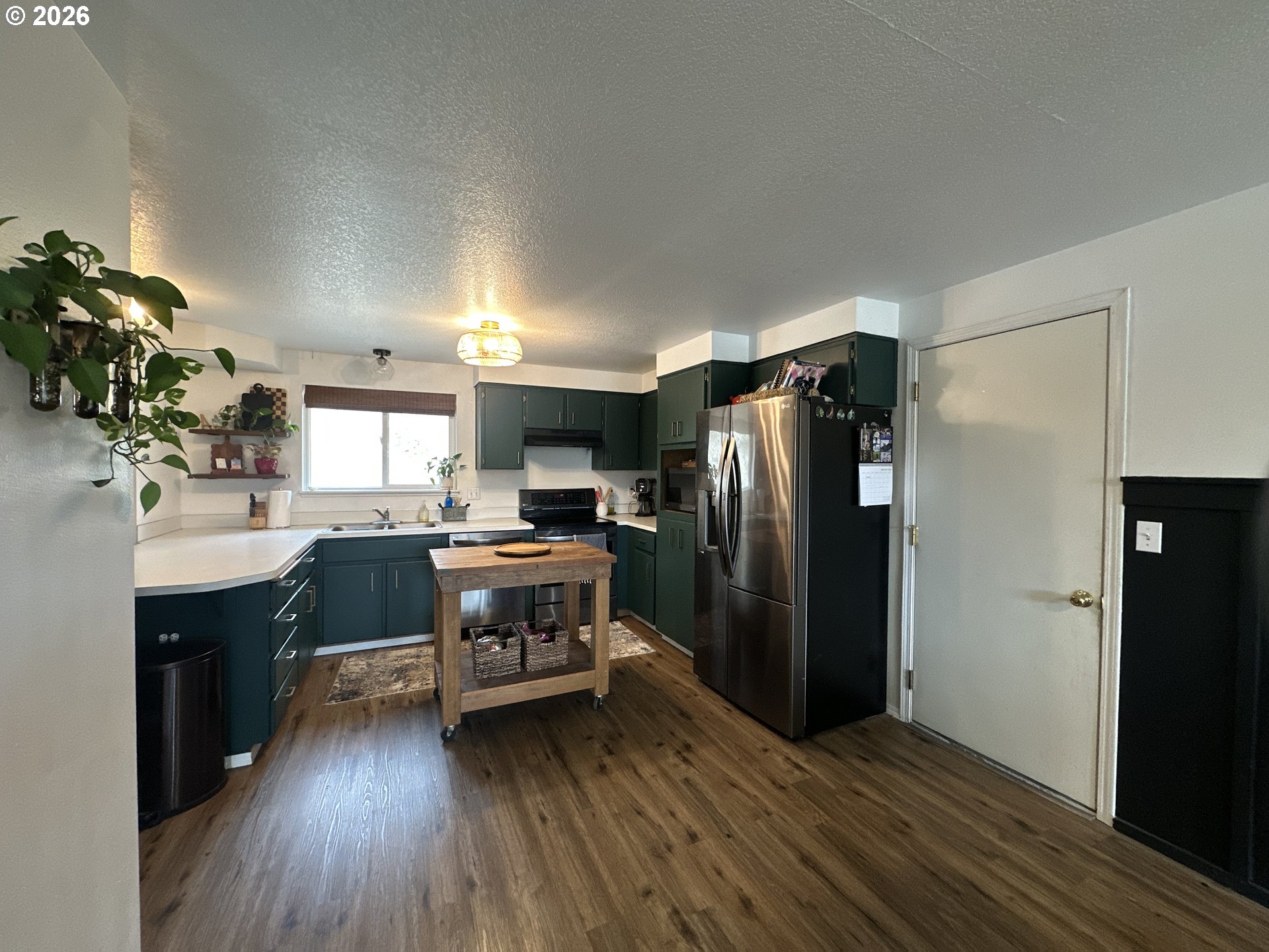 120 Valley View Drive John Day, OR 97845 - Photo 4 of 34 a kitchen with a refrigerator and a sink