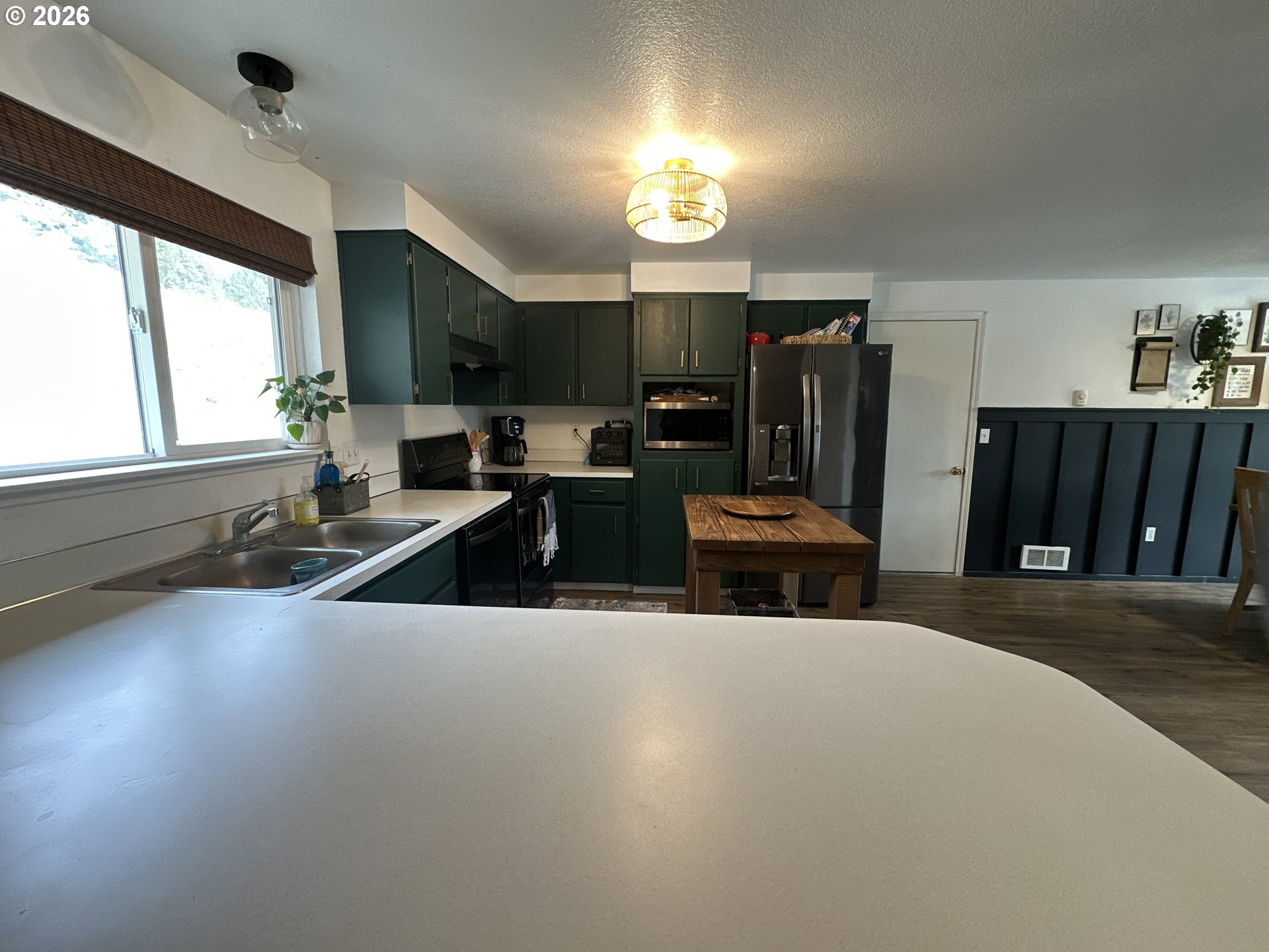 120 Valley View Drive John Day, OR 97845 - Photo 8 of 34 a kitchen with sink refrigerator and large window