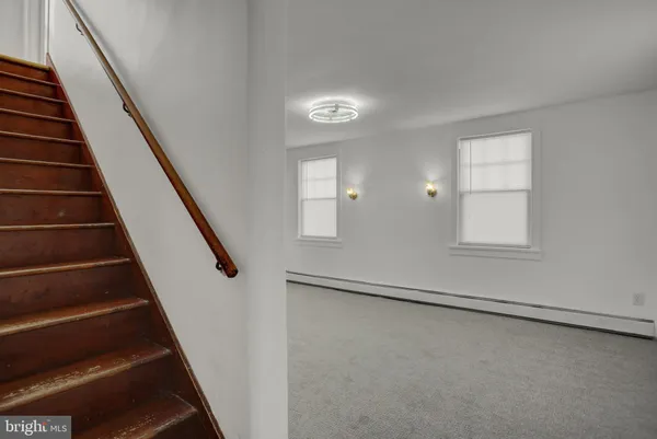an entryway in a room with stairs