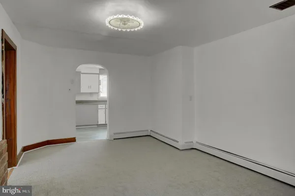 an empty room with a empty space and windows