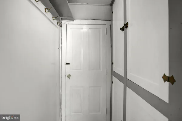 a bathroom with a glass shower door