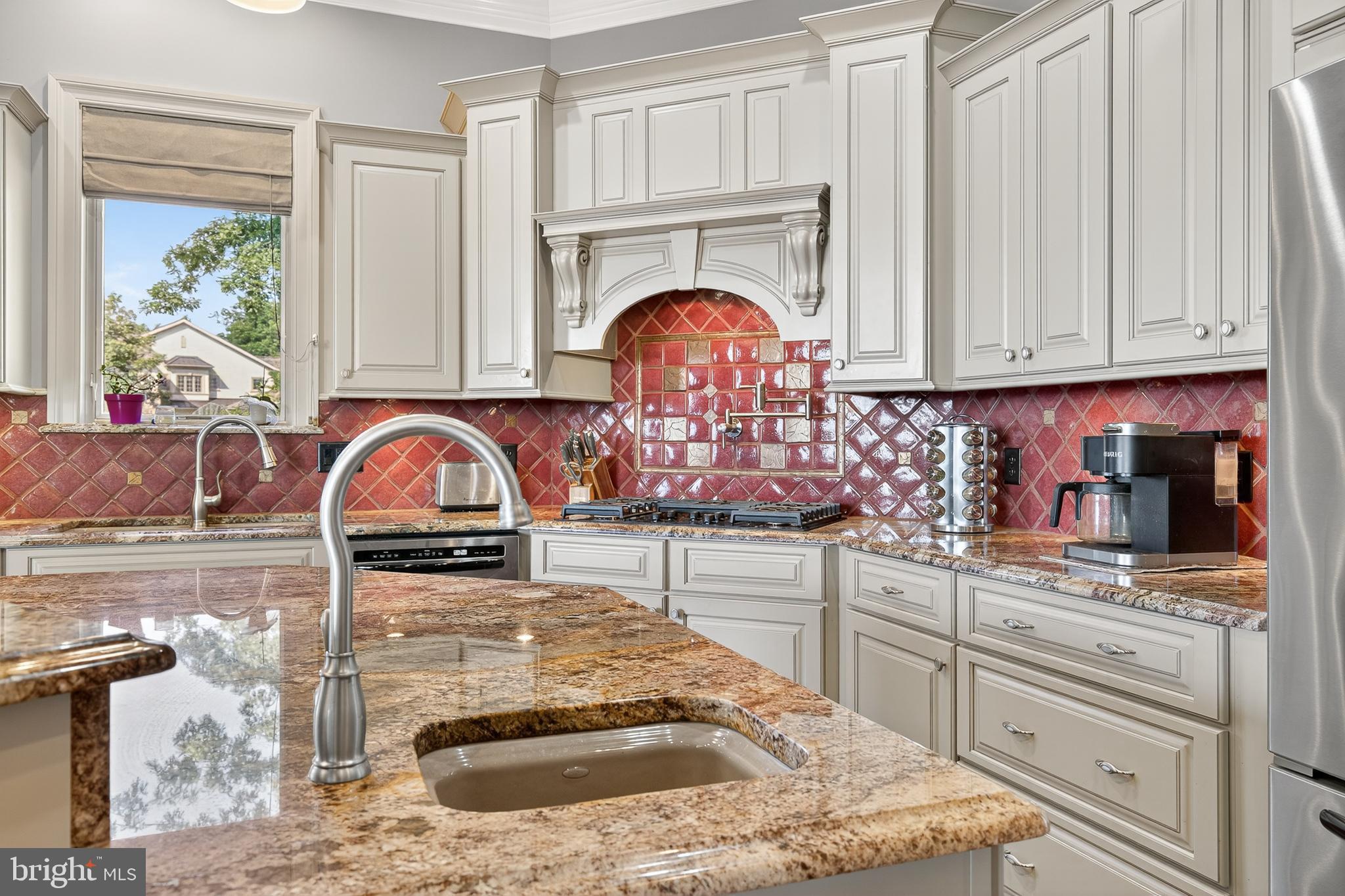 522 Halyard Way Enola, PA 17025 - Photo 32 of 60 a kitchen with granite countertop a stove and white cabinets