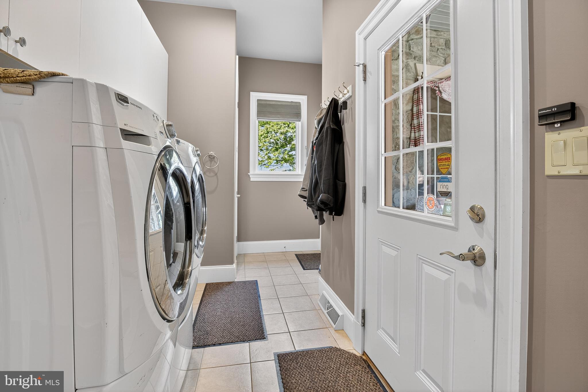 522 Halyard Way Enola, PA 17025 - Photo 39 of 60 a view of a hallway with a washer and dryer