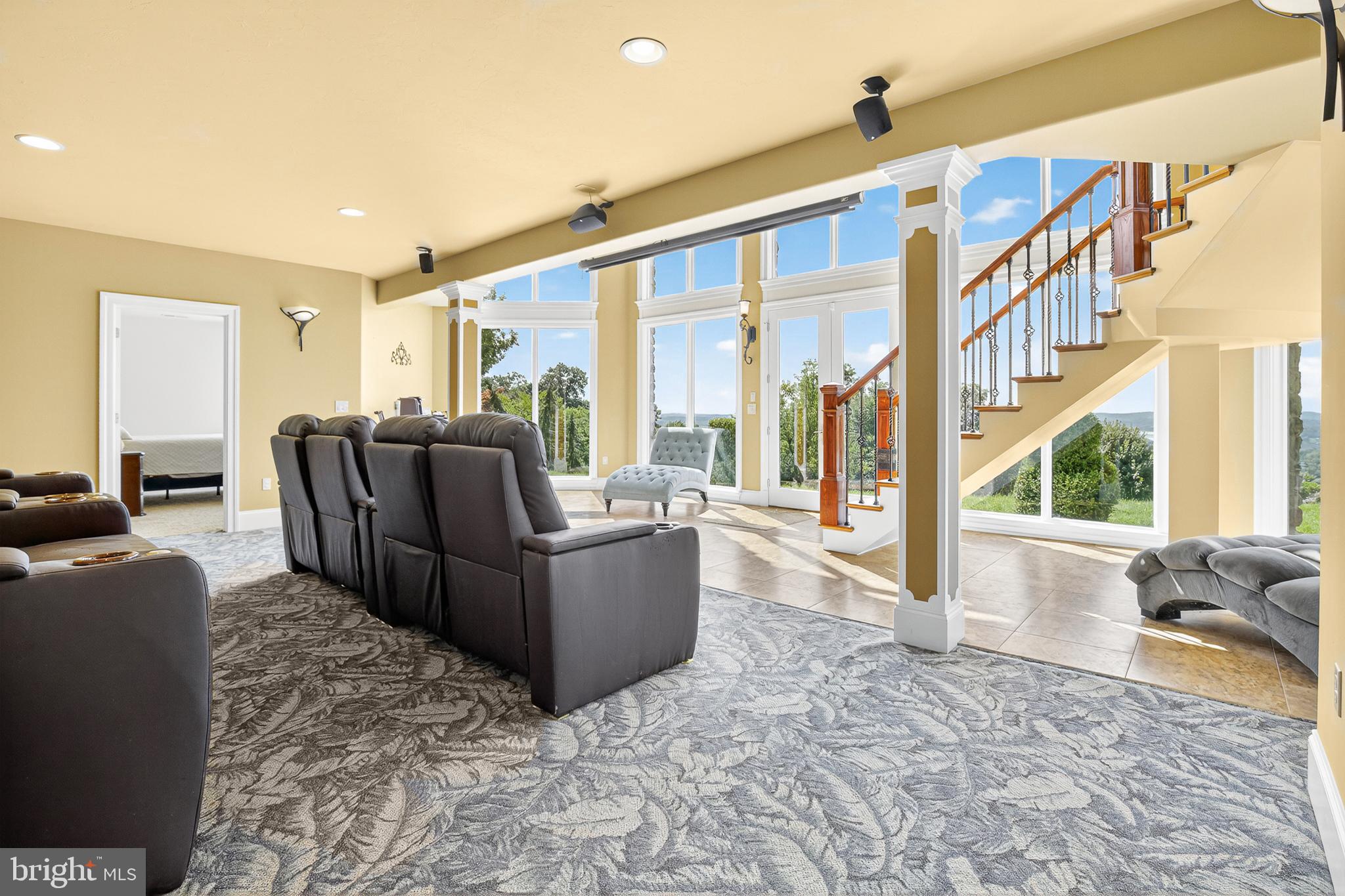 522 Halyard Way Enola, PA 17025 - Photo 54 of 60 a living room with furniture large windows wooden floor and a chandelier