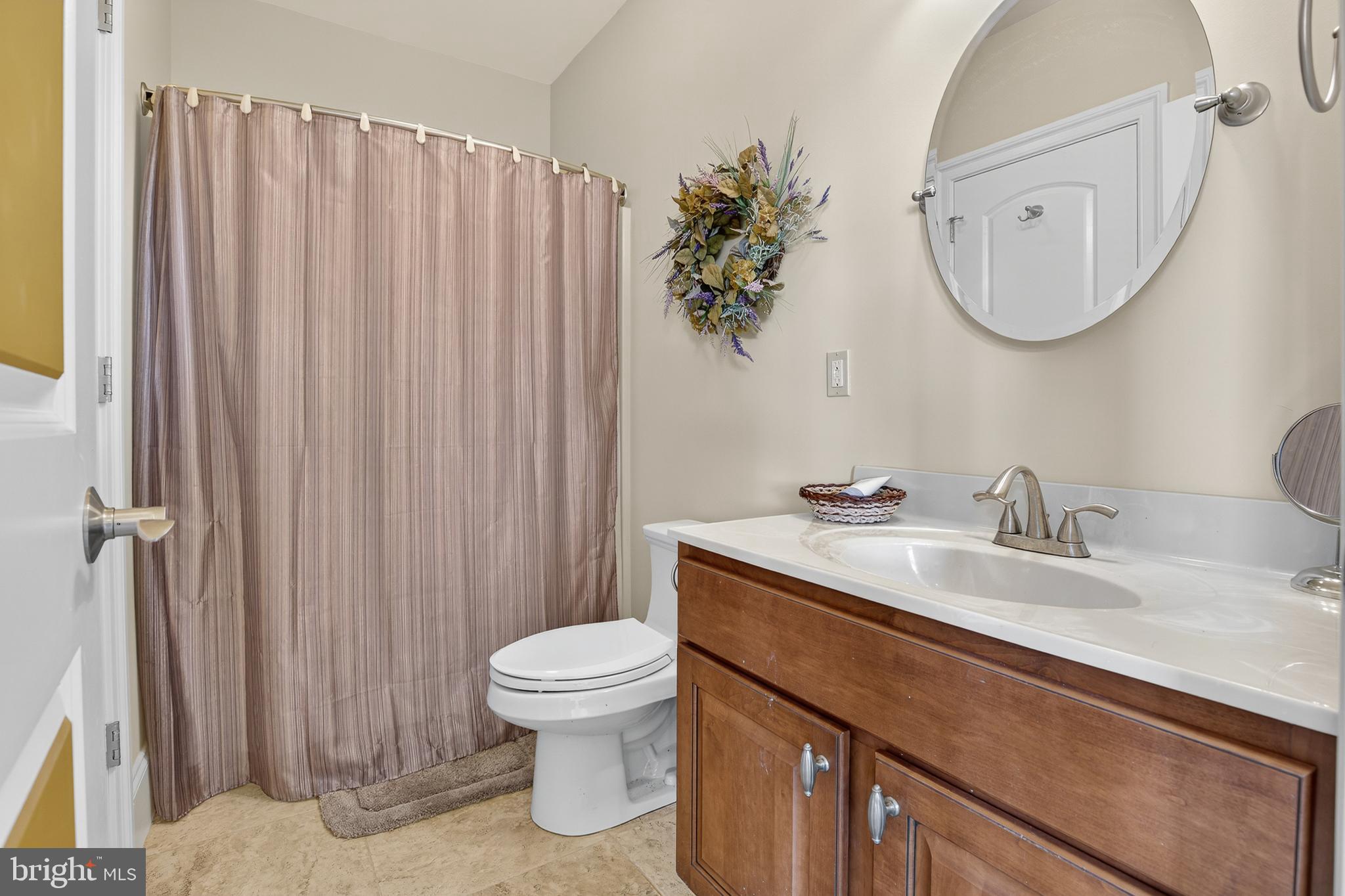 522 Halyard Way Enola, PA 17025 - Photo 60 of 60 a bathroom with a toilet a sink and a mirror