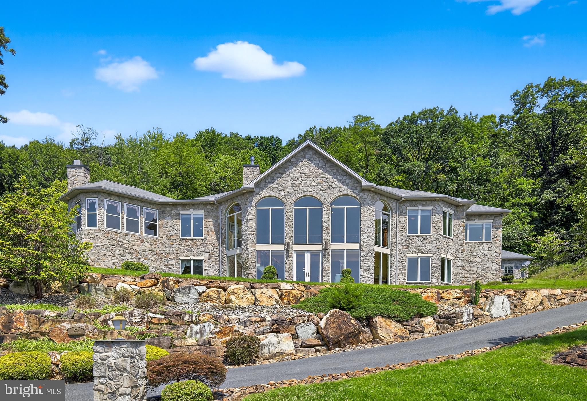 522 Halyard Way Enola, PA 17025 - Photo 9 of 60 a front view of a house with a yard and potted plants