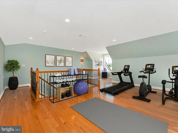 a living room with furniture and a lamp