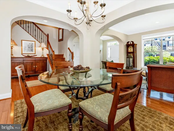 a view of entryway with wooden floor and stairs