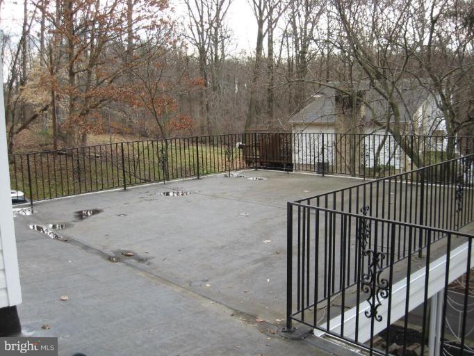 7000 Lancaster Road Gwynn Oak, MD 21207 - Photo 14 of 18 a view of a wrought iron fences in front of house