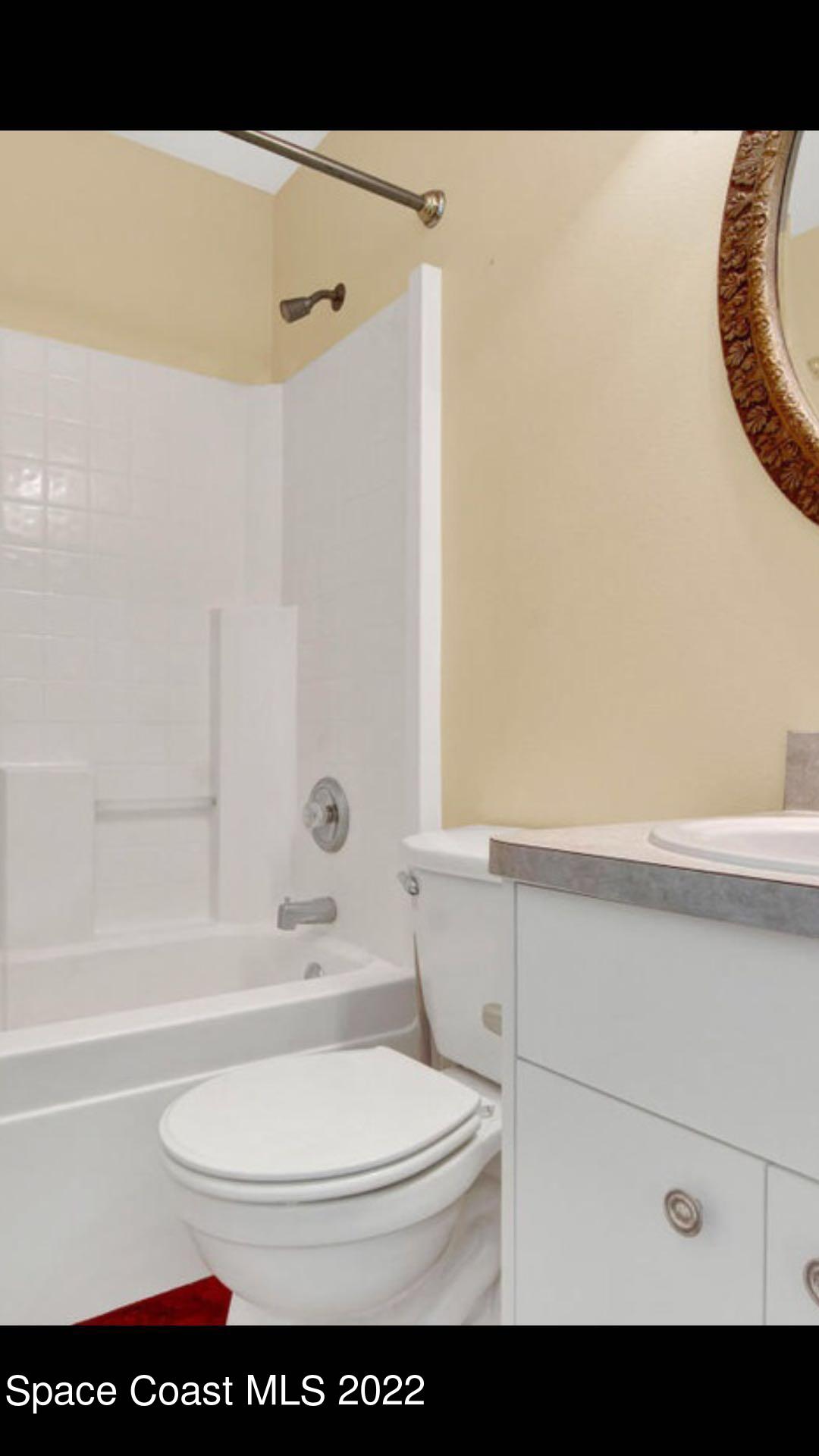 3794 Town Square Boulevard Melbourne, FL 32901 - Photo 15 of 18 a bathroom with a sink a toilet and a bathtub