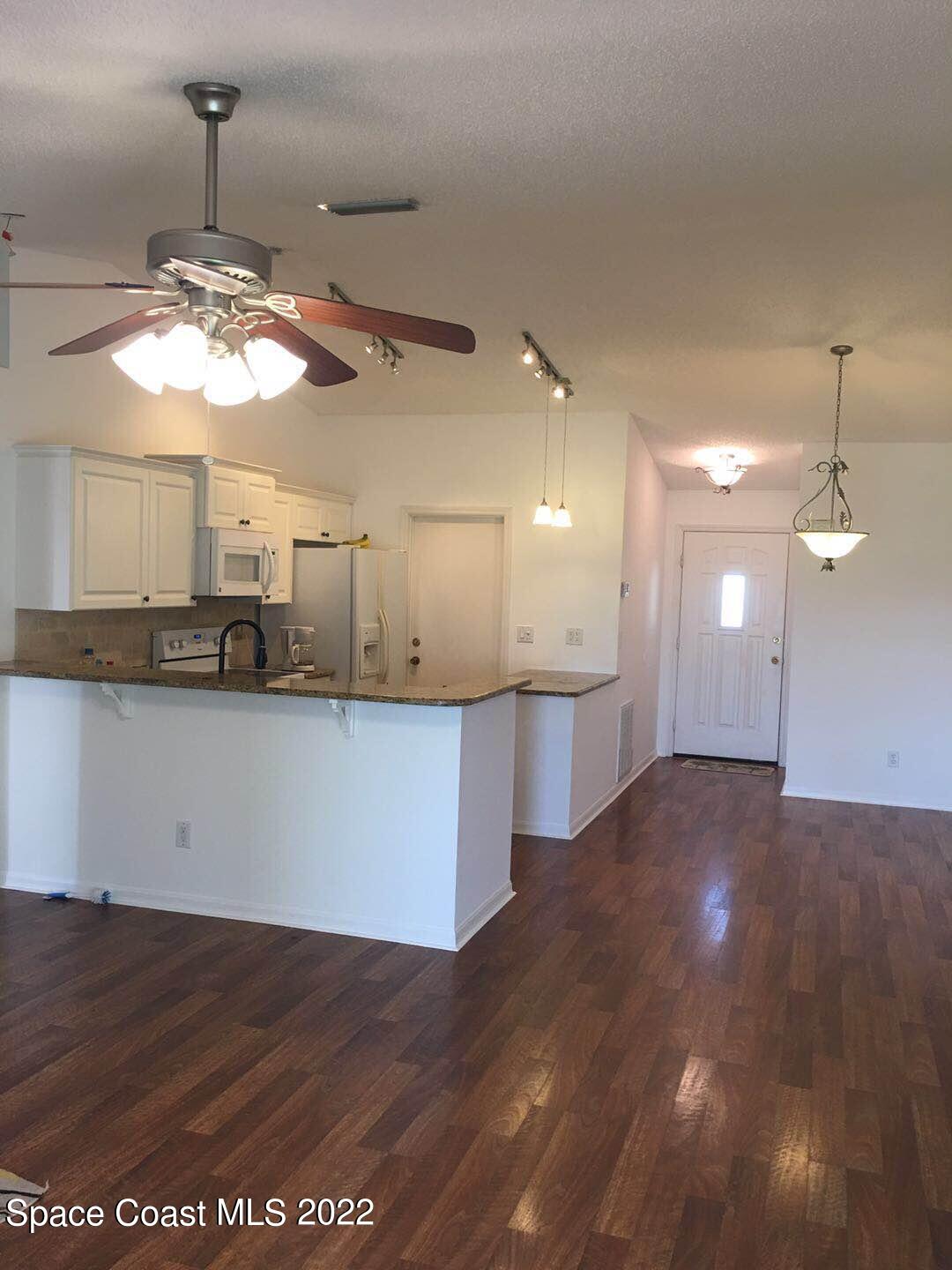 3794 Town Square Boulevard Melbourne, FL 32901 - Photo 7 of 18 a view of a kitchen with a sink and cabinets