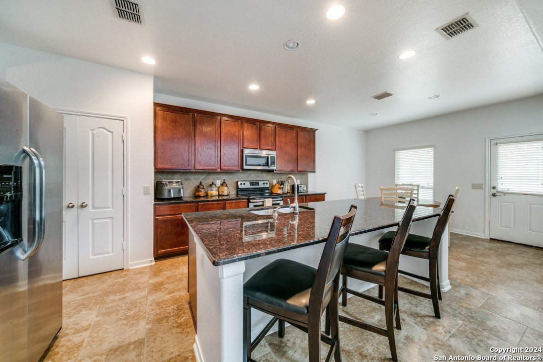 3113 Cameron River Schertz, TX 78108 - Photo 12 of 24 a view of a dining room with furniture