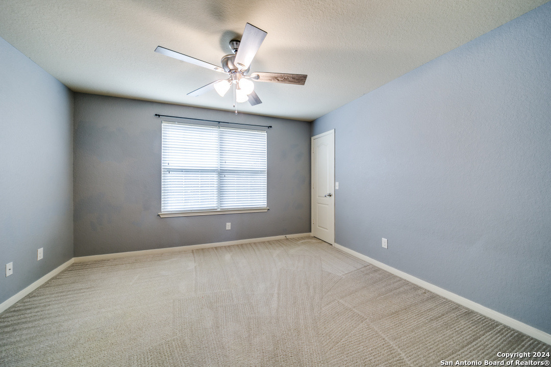 3113 Cameron River Schertz, TX 78108 - Photo 22 of 24 a view of an empty room with a window