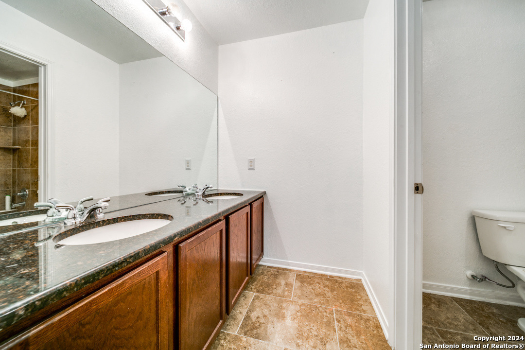 3113 Cameron River Schertz, TX 78108 - Photo 23 of 24 a bathroom with a sink and a mirror