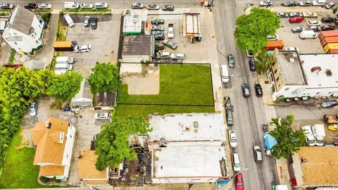 an aerial view of a house with outdoor space