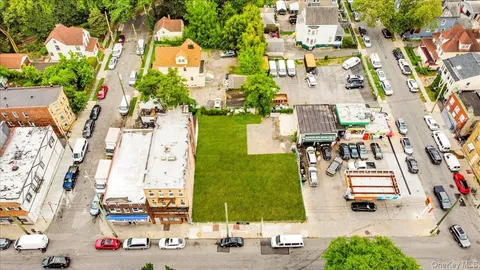 an aerial view of houses with outdoor space