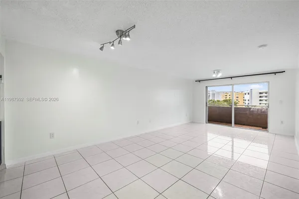 a view of an empty room and window