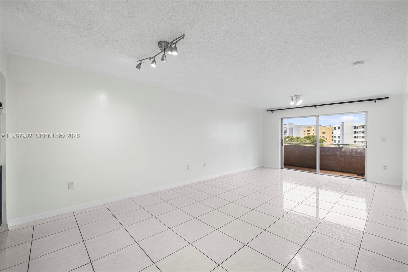 18001 North Bay Road, Unit 505 Sunny Isles Beach, FL 33160 - Photo 7 of 16 a view of an empty room and window