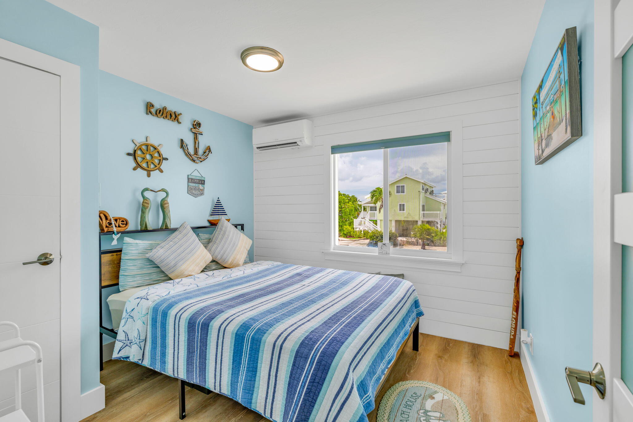 28538 John Silver Road Summerland Key, FL 33042 - Photo 17 of 45 a bedroom with a bed and a window