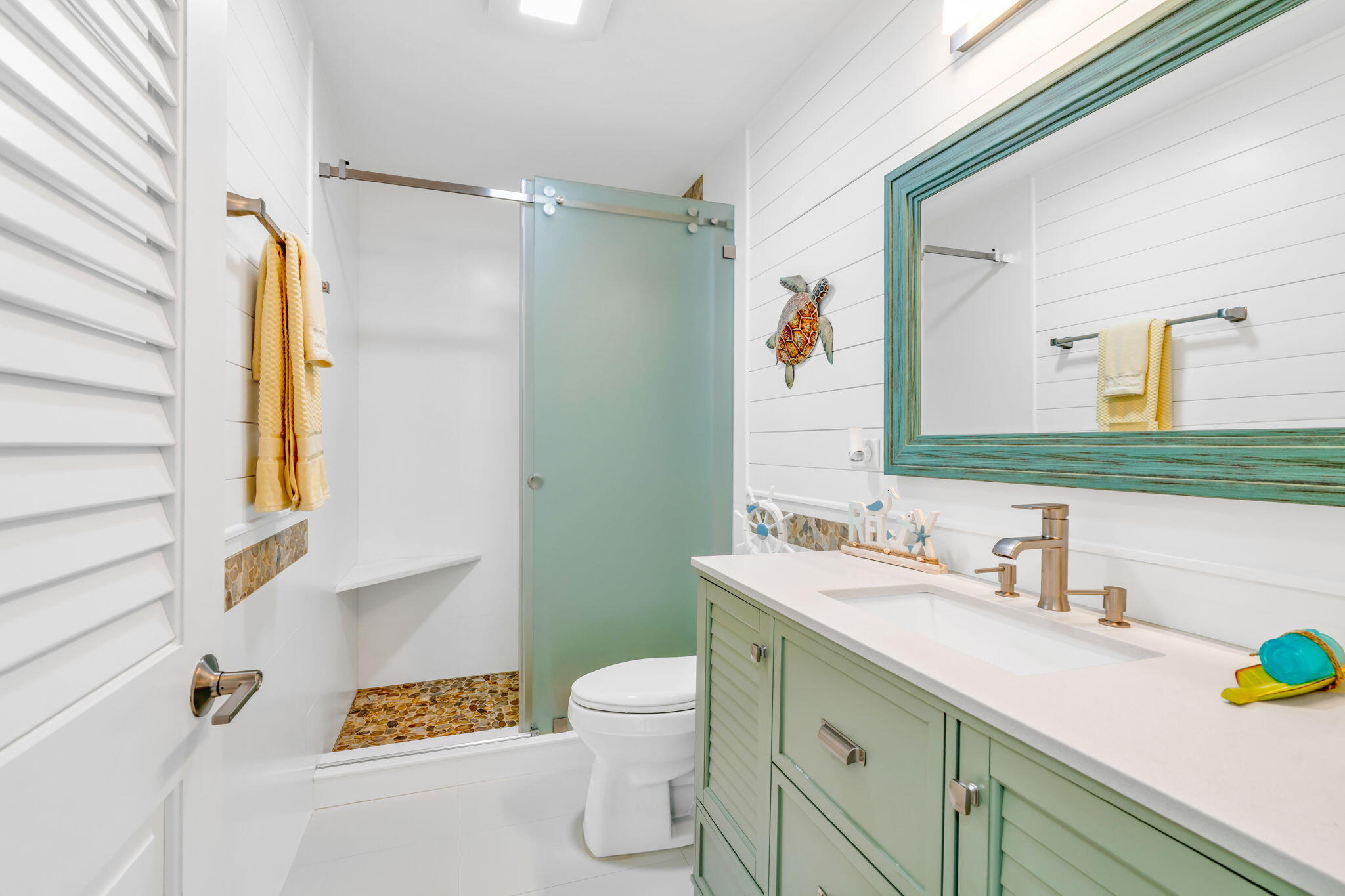 28538 John Silver Road Summerland Key, FL 33042 - Photo 19 of 45 a bathroom with a sink mirror vanity and toilet