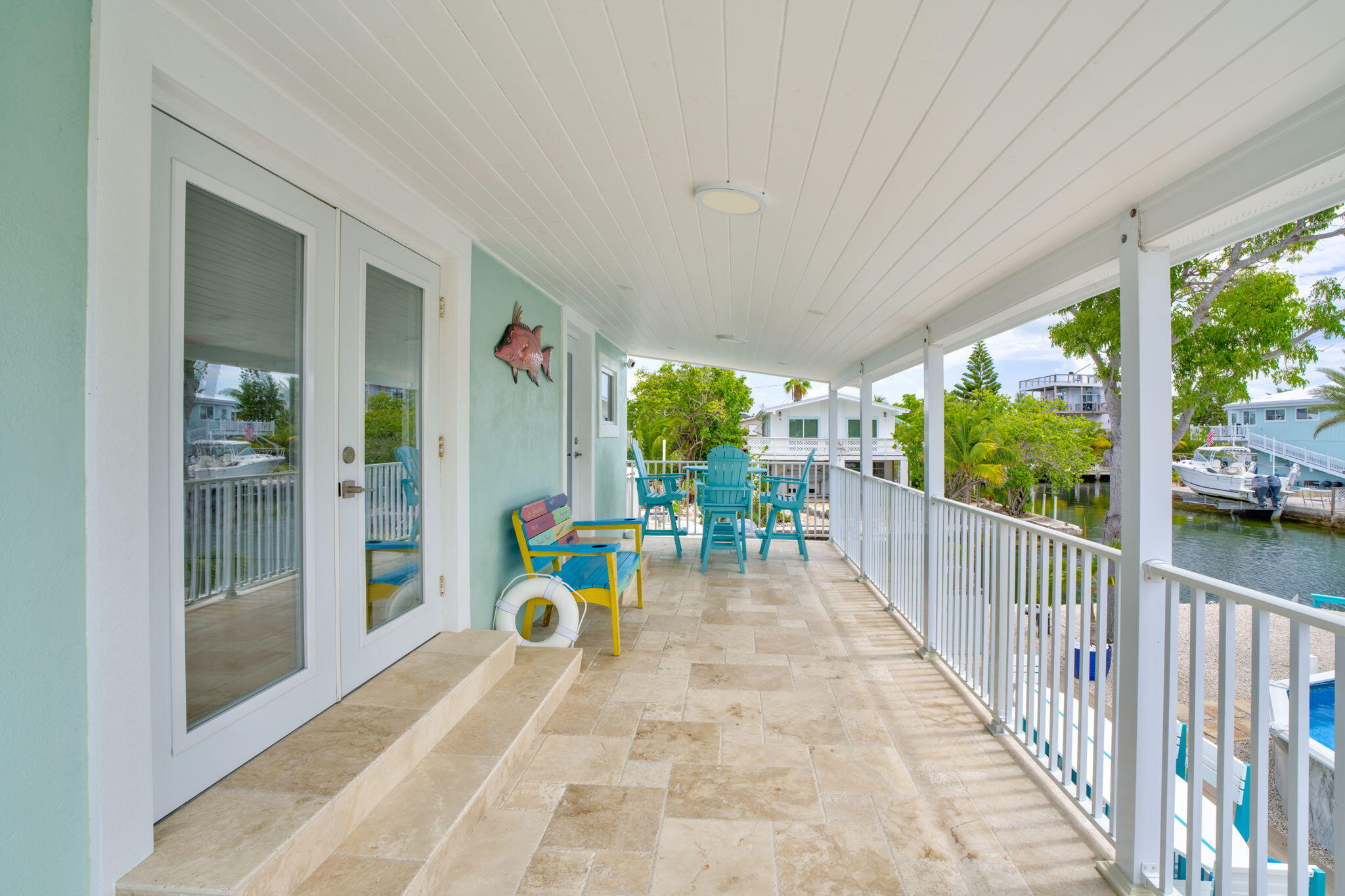 28538 John Silver Road Summerland Key, FL 33042 - Photo 26 of 45 a view of porch with wooden floor and outdoor seating