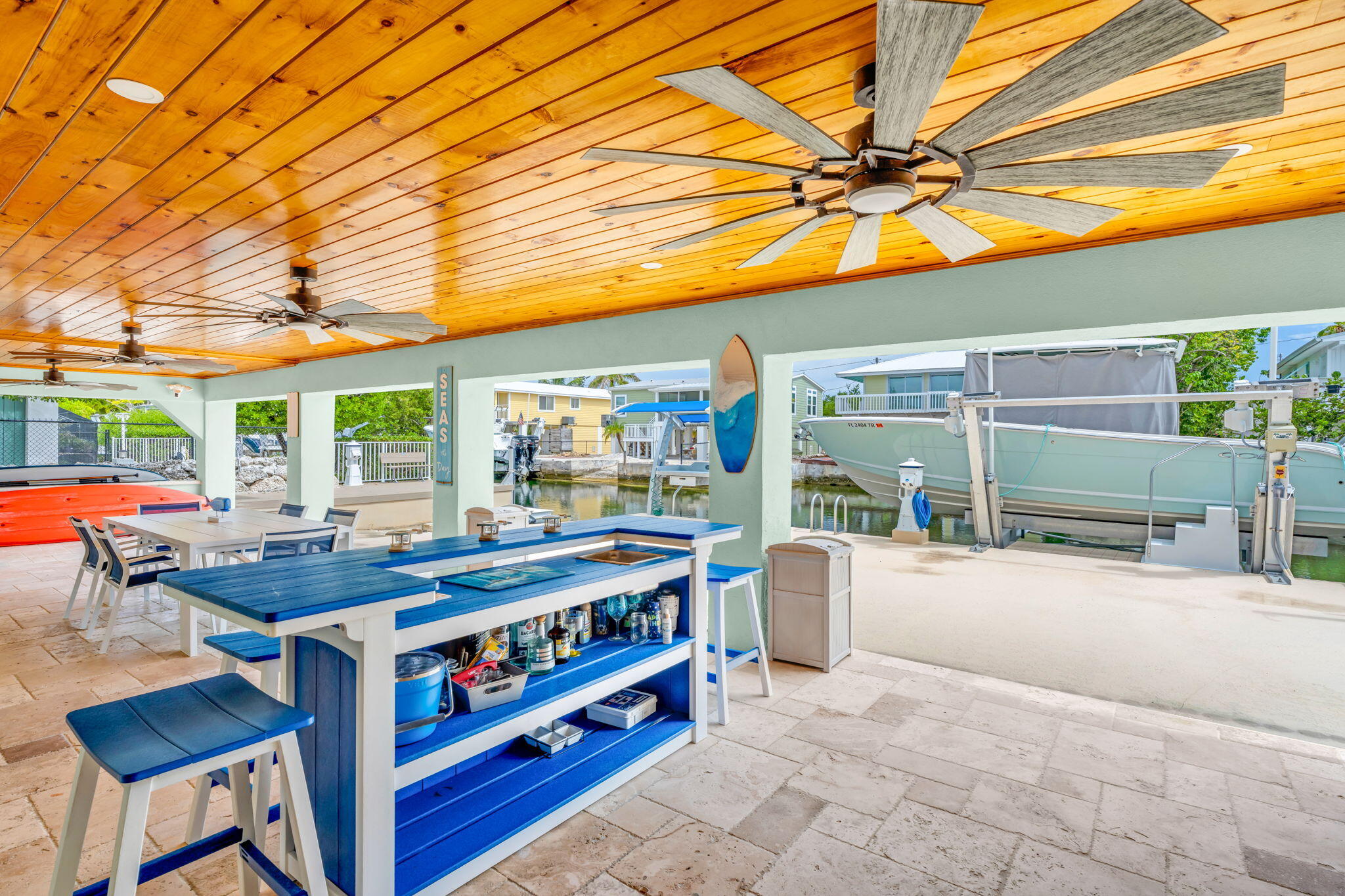 28538 John Silver Road Summerland Key, FL 33042 - Photo 31 of 45 a view of a patio with a table and chairs under an umbrella