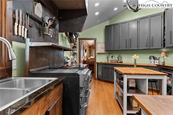 a kitchen with stainless steel appliances granite countertop a stove and a microwave