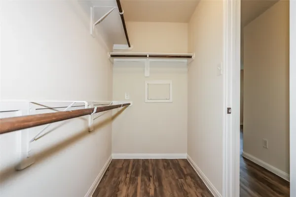 a view of a balcony with wooden floor