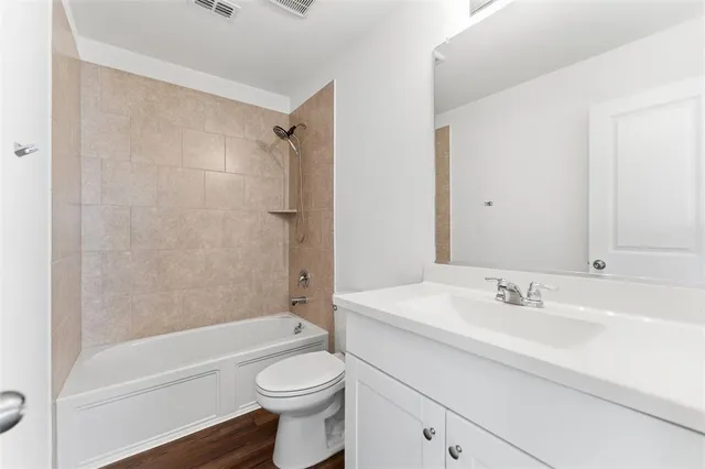 a bathroom with a sink toilet and a bathtub