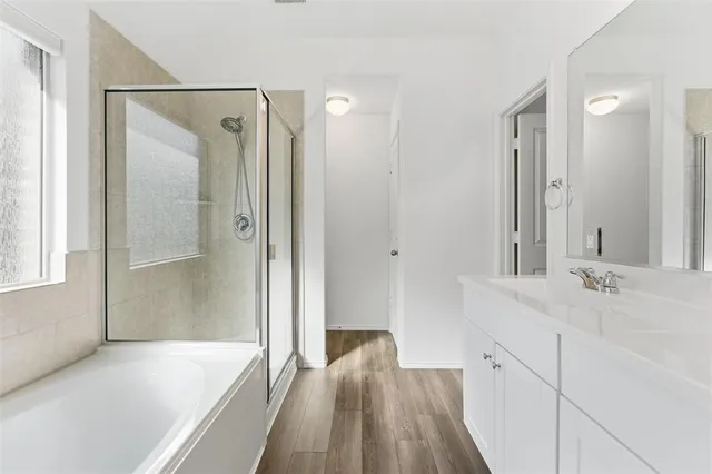 a bathroom with a sink and a shower