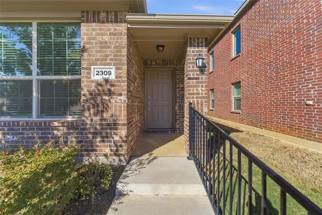a view of a balcony with a potted plant