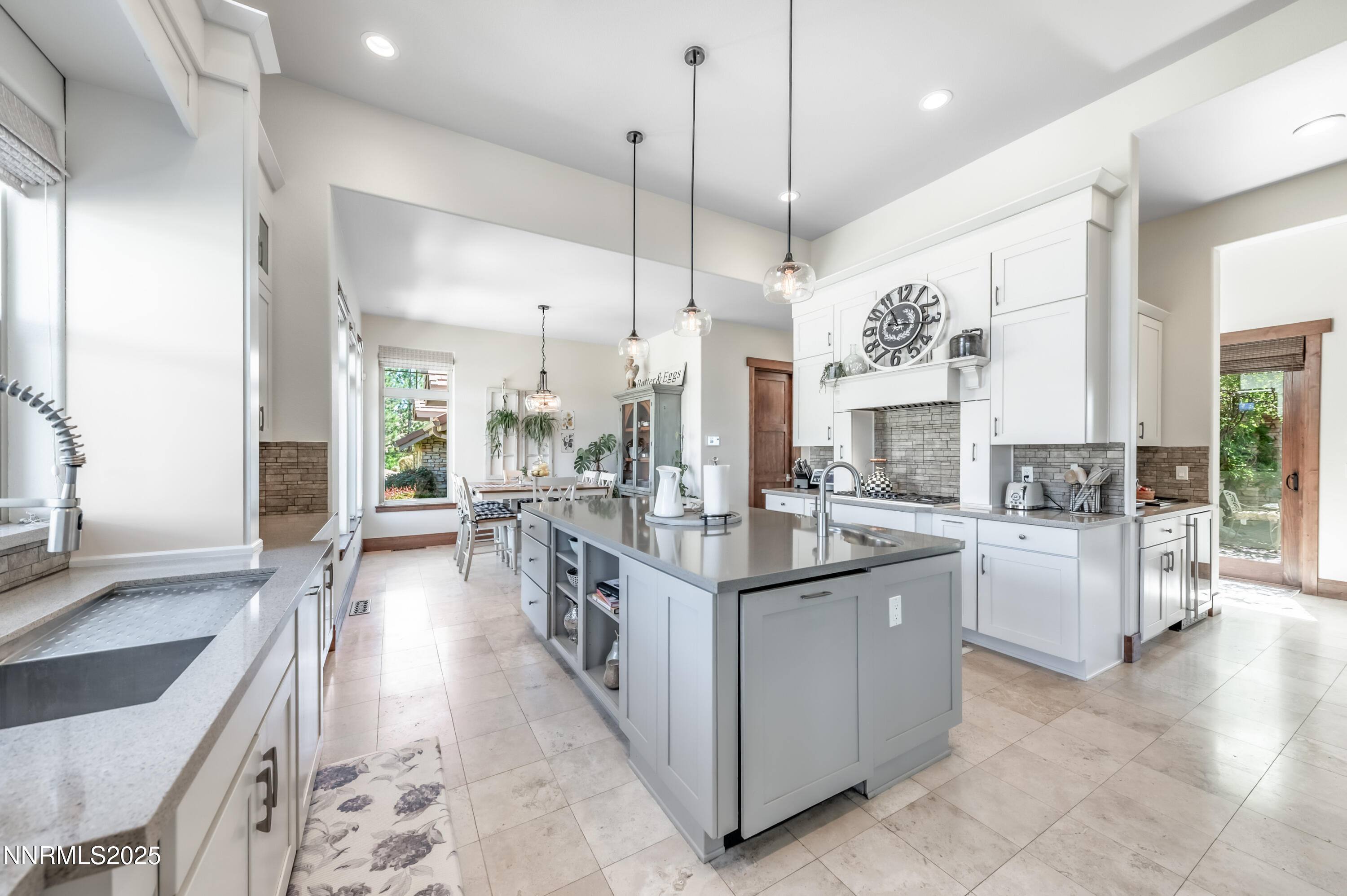 2195 Candle Rock Court Reno, NV 89523 - Photo 11 of 29 a open kitchen with stainless steel appliances granite countertop a stove and cabinets