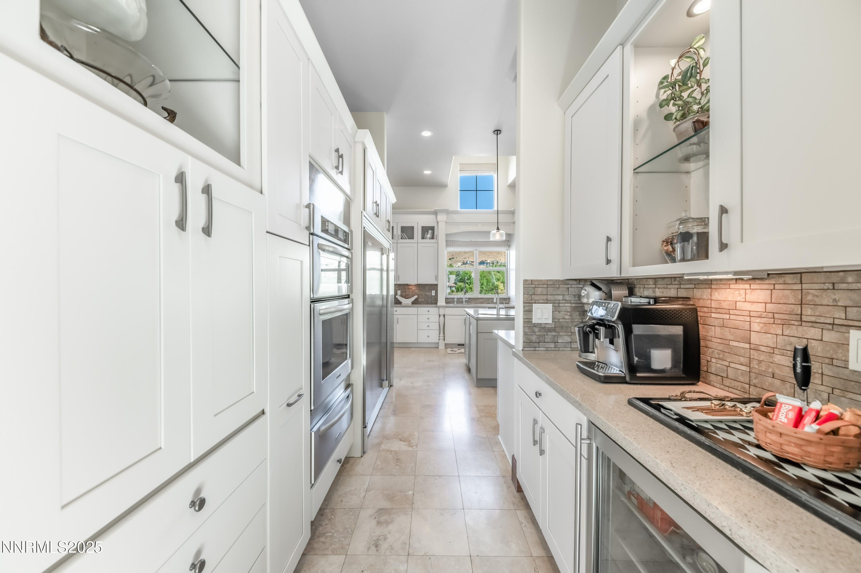2195 Candle Rock Court Reno, NV 89523 - Photo 14 of 29 a kitchen with stainless steel appliances granite countertop a stove a sink and a refrigerator