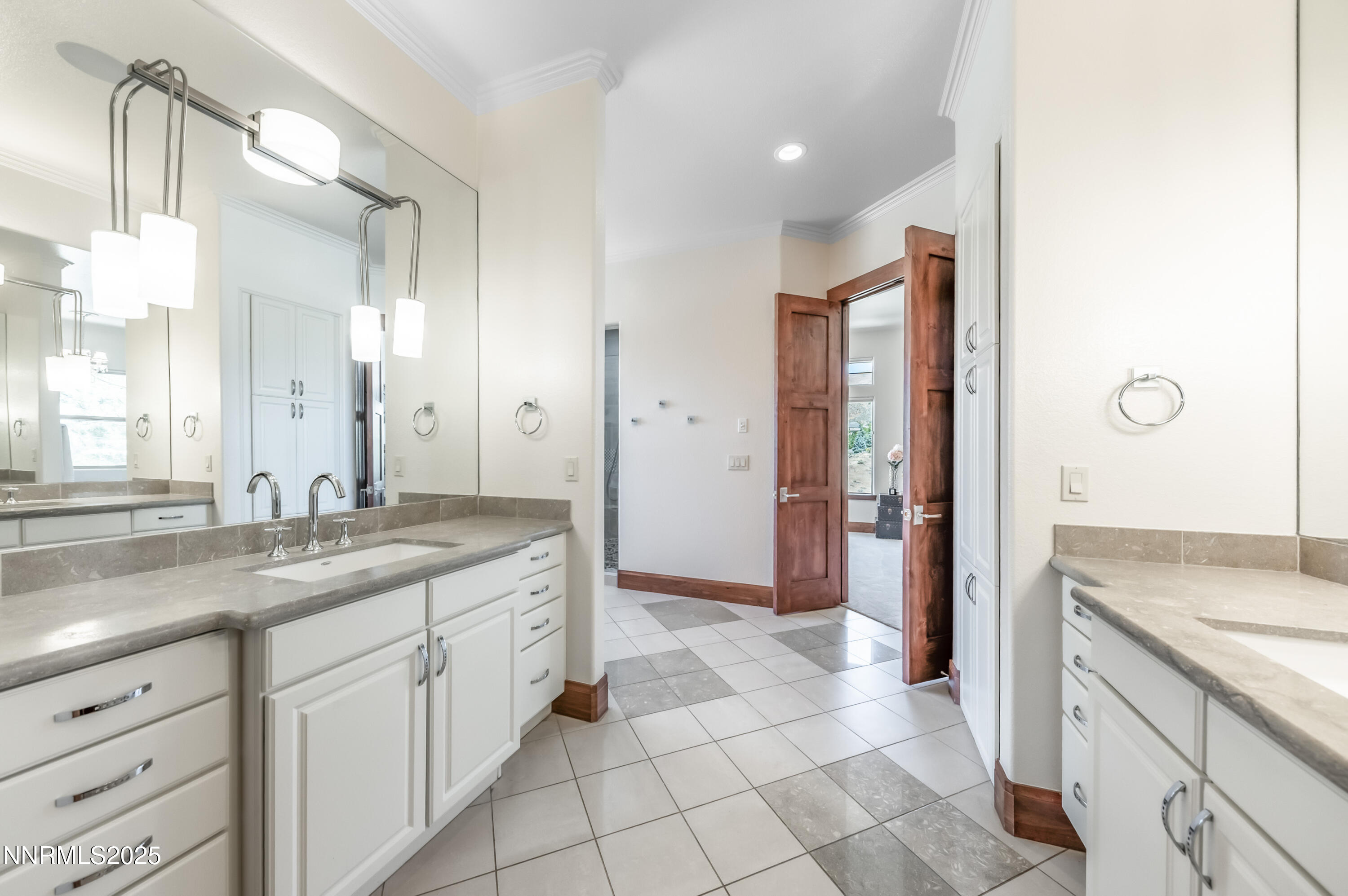 2195 Candle Rock Court Reno, NV 89523 - Photo 19 of 29 a spacious bathroom with a granite countertop sink a mirror and a shower