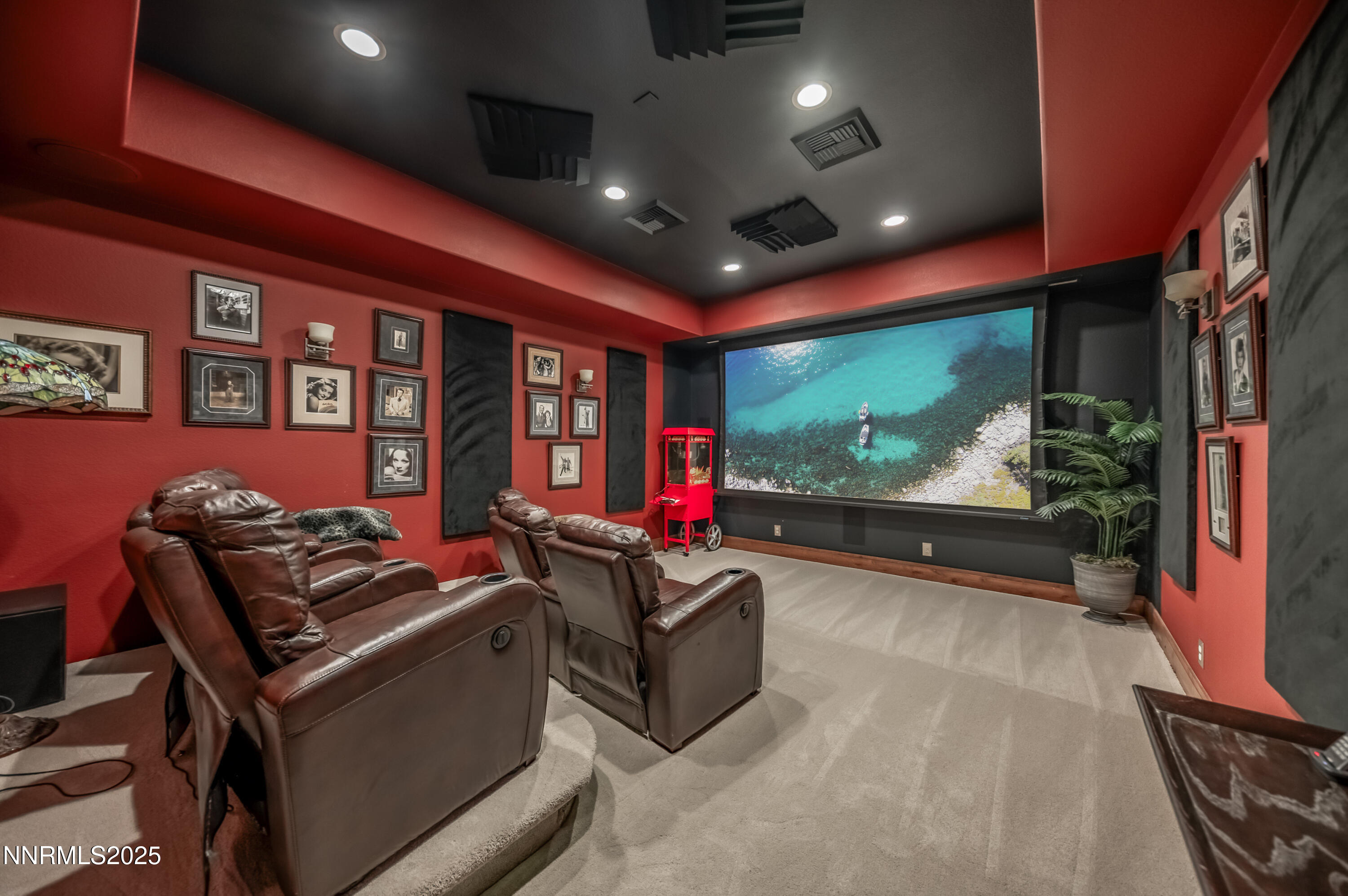 2195 Candle Rock Court Reno, NV 89523 - Photo 22 of 29 a room with furniture and a projector screen