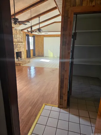 a view of walk in closet with empty shelves
