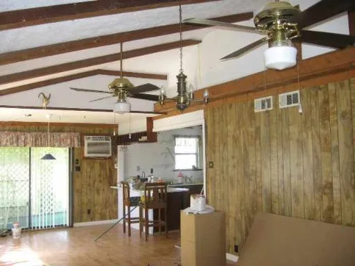 a view of a room with a window and chandelier