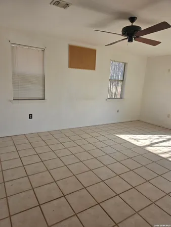 a view of an empty room and window