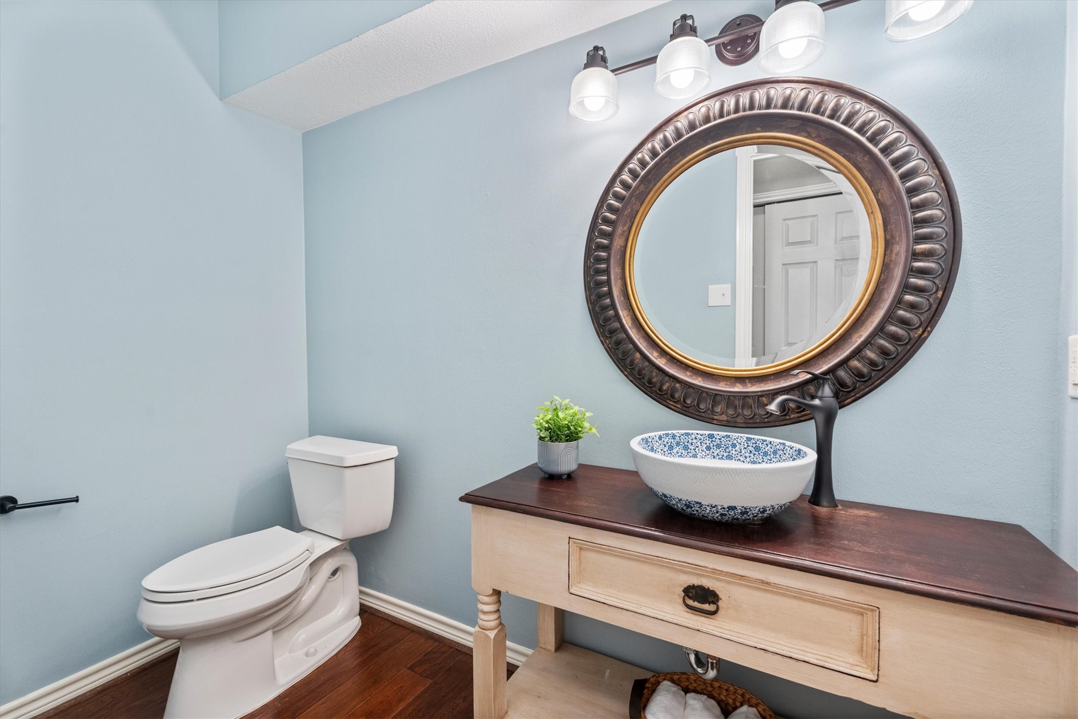 16267 Salmon Lane Spring, TX 77379 - Photo 21 of 48 An oversized half bath, updated in 2021, is privately located off the family room, complemented by a lovely vanity and sink.