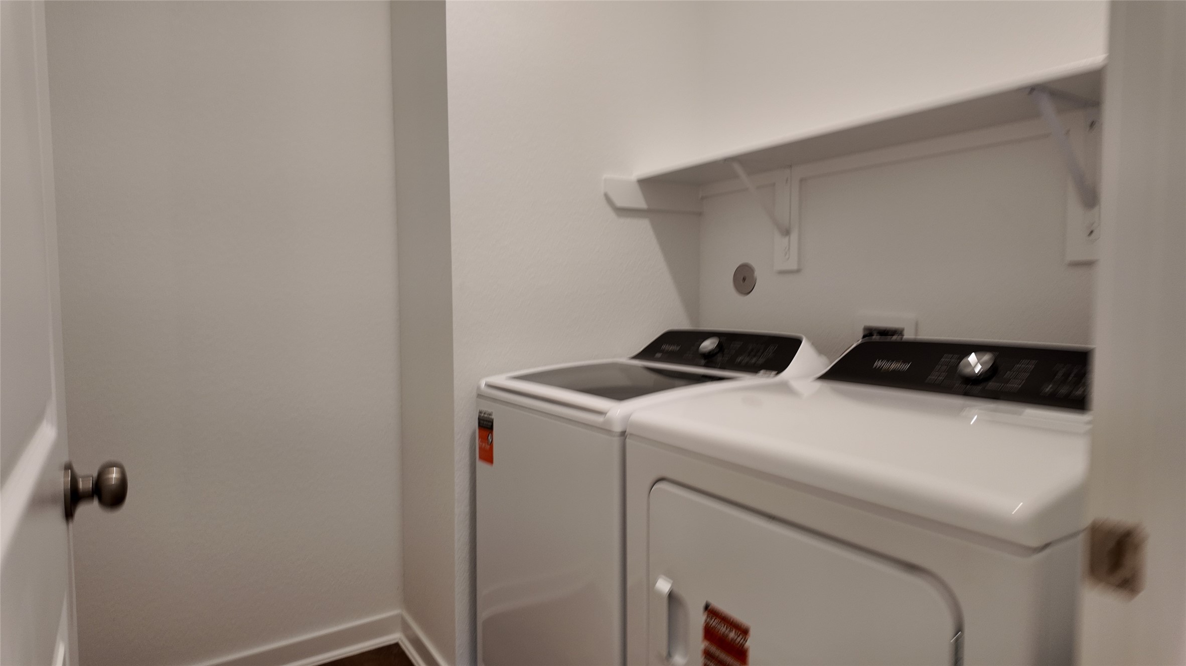 15645 Wandering Maple Way Conroe, TX 77302 - Photo 6 of 14 a utility room with dryer and washer