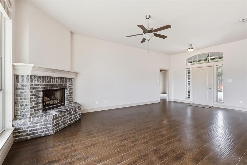 2512 Guinn Farms Road Tyler, TX 75707 - Photo 14 of 29 a living room with furniture and a fireplace
