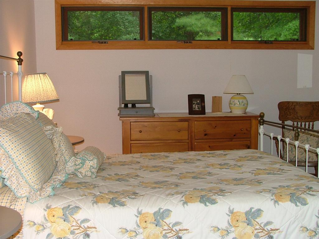 7 Old Tree Farm Road Stockbridge, MA 01266 - Photo 14 of 21 a bedroom with a bed and a window