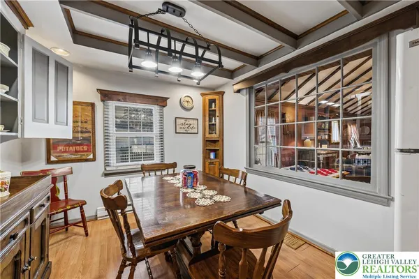 a view of a dining room with furniture window and outside view