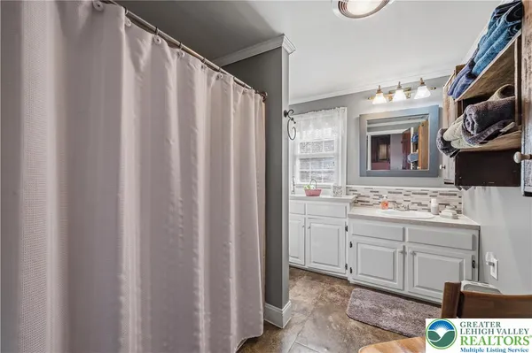 a bathroom with a sink a vanity and a mirror