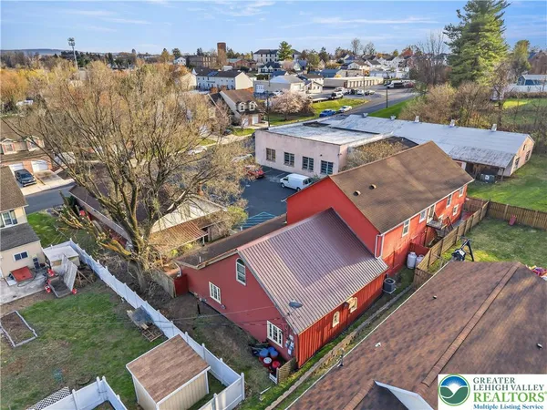 an aerial view of a house with a garden