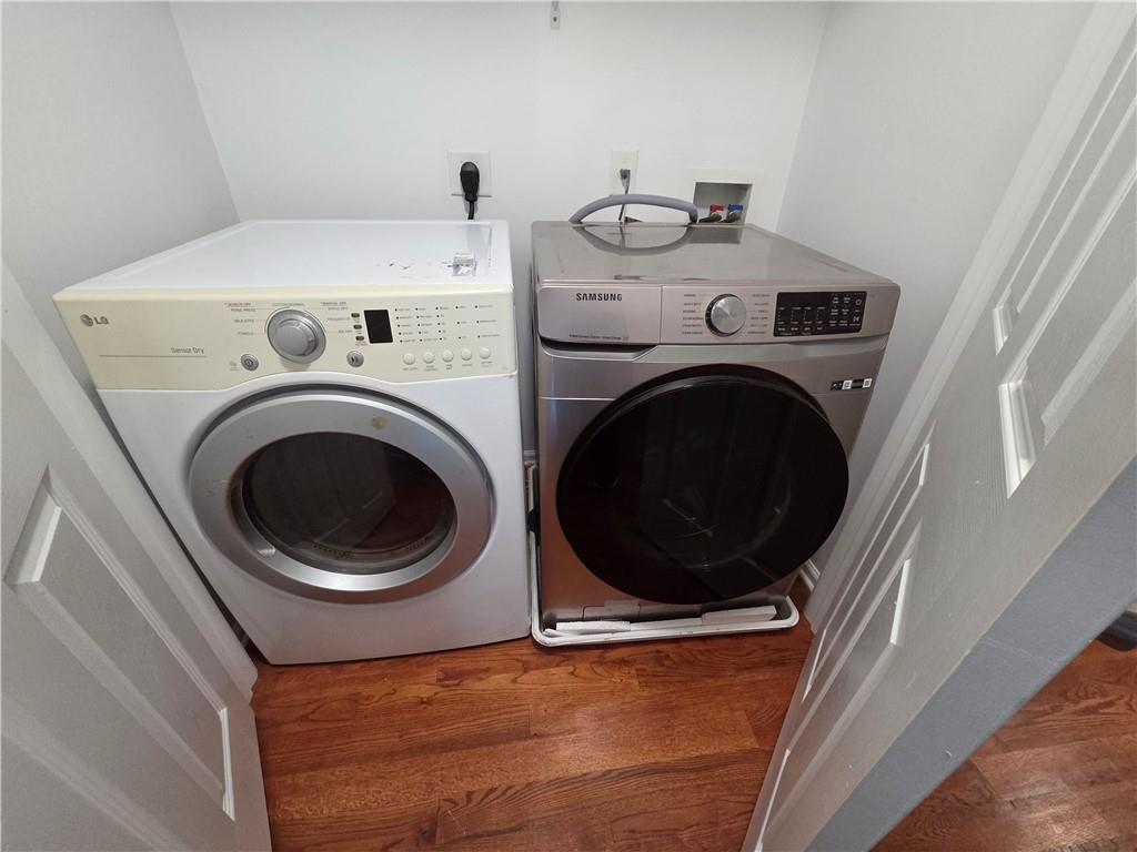 5834 Bridgeport Court Flowery Branch, GA 30542 - Photo 14 of 19 a utility room with dryer and washer