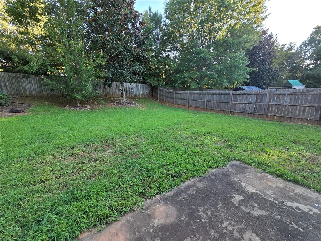 5834 Bridgeport Court Flowery Branch, GA 30542 - Photo 19 of 19 a backyard of a house with lots of green space