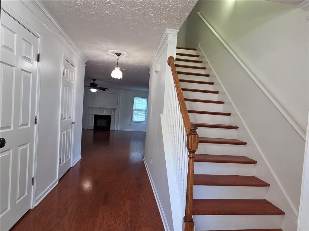 5834 Bridgeport Court Flowery Branch, GA 30542 - Photo 8 of 19 a view of entryway and hall with wooden floor