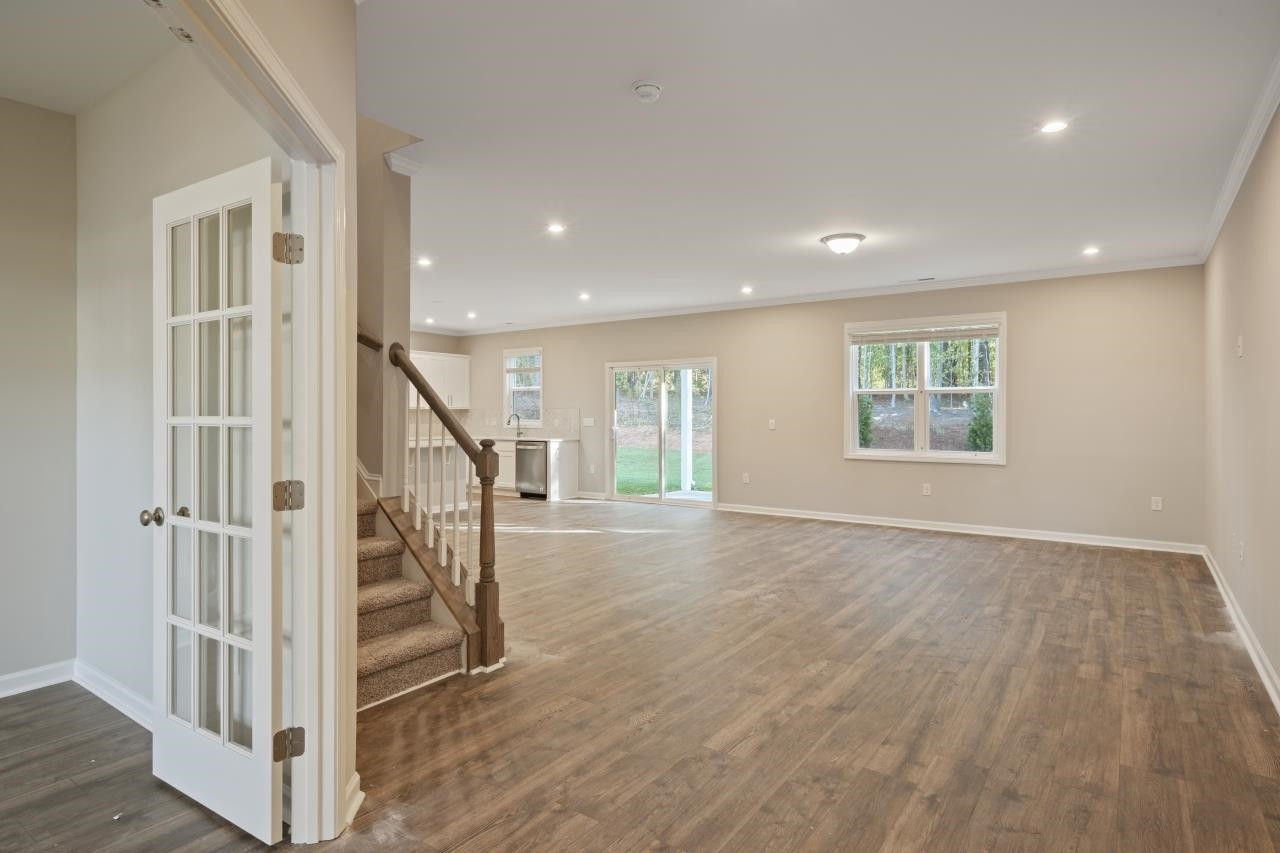 267 Madden Rose Loop Garner, NC 27529 - Photo 12 of 41 a view of entryway with wooden floor and stairs