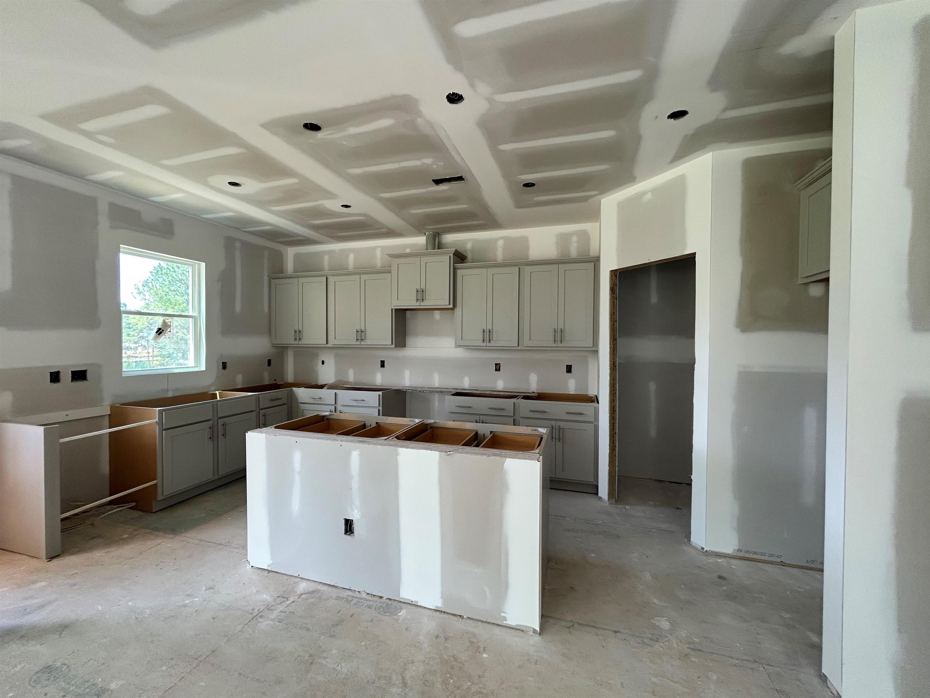 267 Madden Rose Loop Garner, NC 27529 - Photo 5 of 41 a kitchen with stainless steel appliances a sink stove and refrigerator